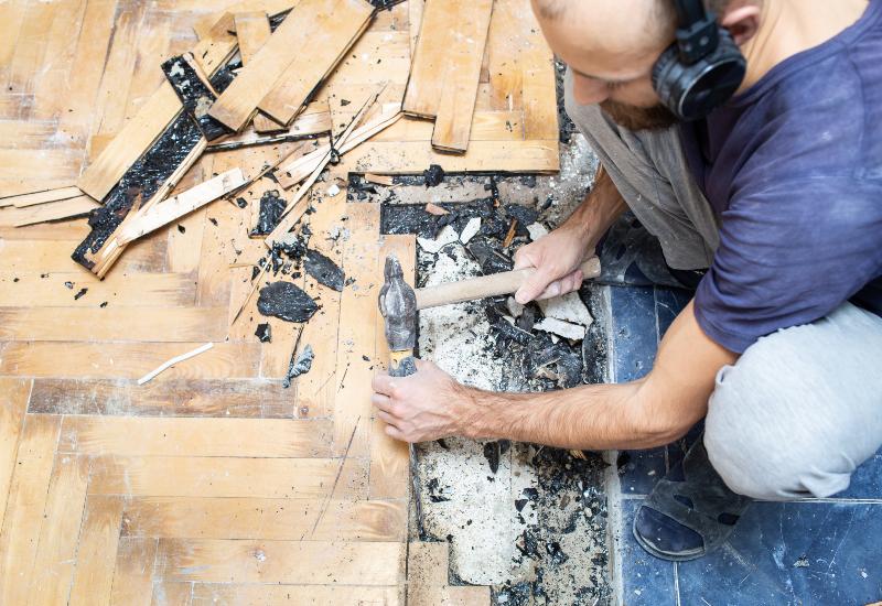 Man Removing Hardwood Flooring Hardwood & Wood Flooring Removal Services in Columbia, MD